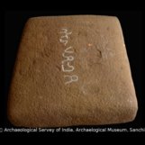 Nearly square lid of stone relic box. 